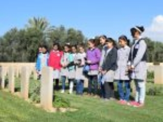 30. A group of female students look at the history of some headstones during an educational visit by their school to the CWGC local war graves in Gaza strip (Photo courtesy of CWGC)